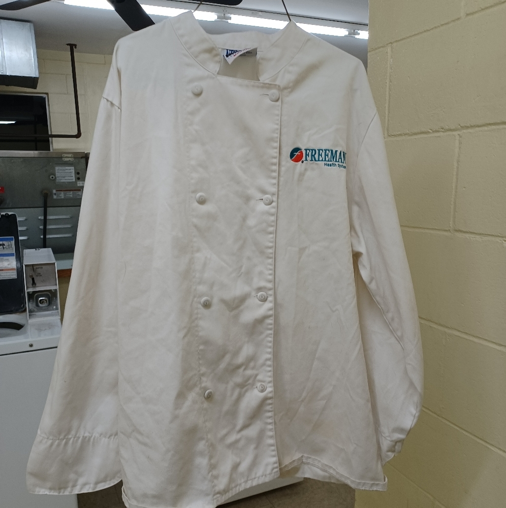 Chef coat size medium color white Freeman Hospital emblems